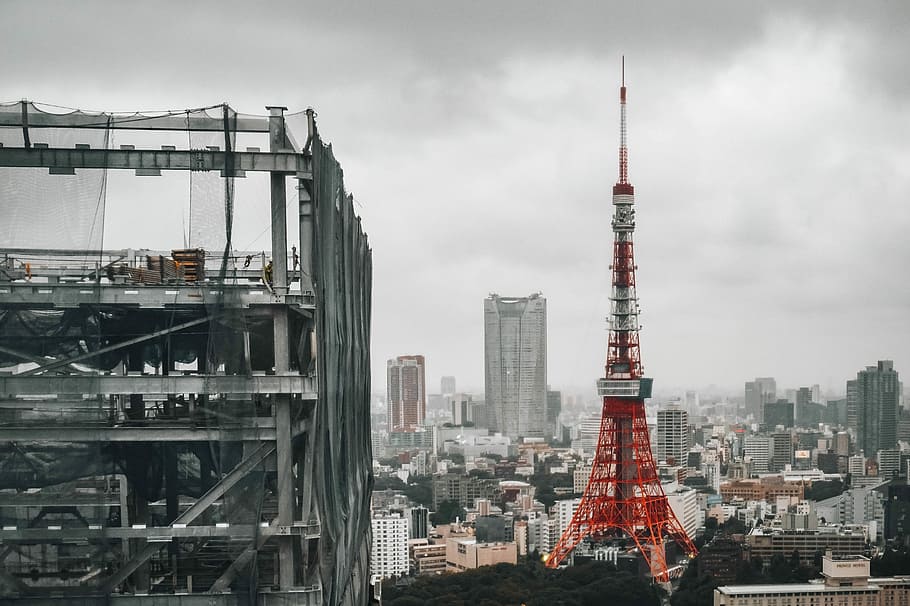 selective color photography of Eiffel tower Paris, Tokyo tower surrounded with buildings under gray cloudy sky during daytime HD wallpaper