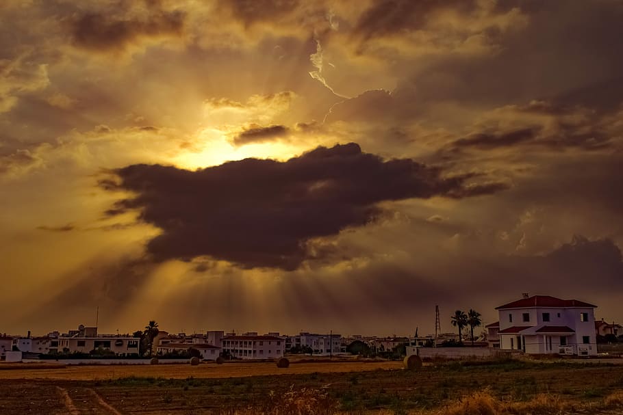 clouds covering sunlight above city, sunset, sky, landscape HD wallpaper