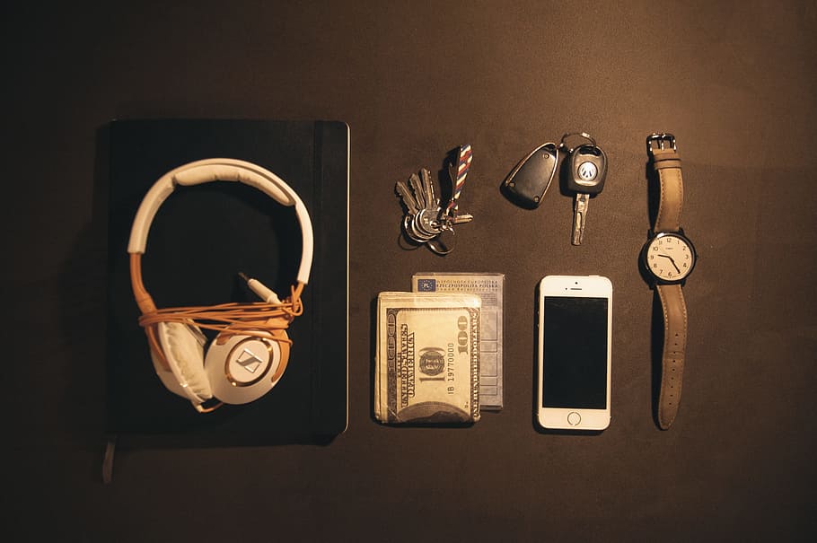 white and brown corded headphones near silver iPhone 5s, knoll