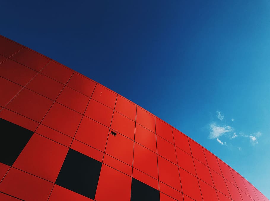 red hi-rise building, low-angle photography of red concrete building HD wallpaper