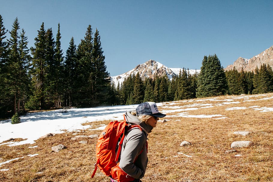 woman with back pack hiking, woman carrying orange backpack, mountain HD wallpaper