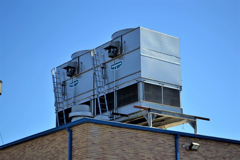 grey metal container on top of building roof, cooling, system