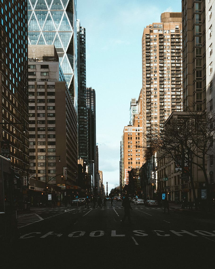 people walking on streets during daytime, asphalt road between high-rise building HD wallpaper
