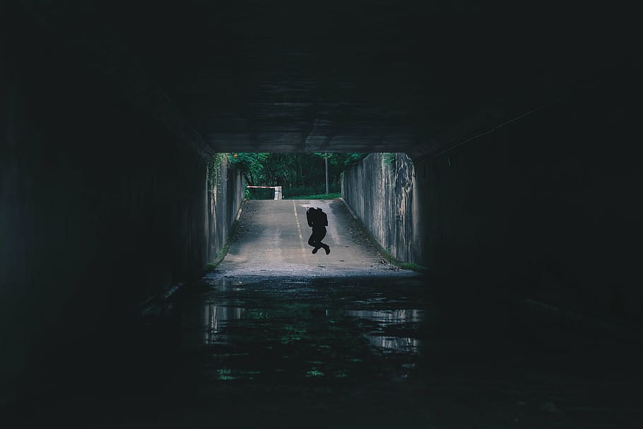 person jumping under tunnel, road, dark, path, people, water HD wallpaper