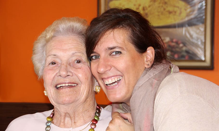 two women in beige and gray shirts, grandma, seniorin, grandmother