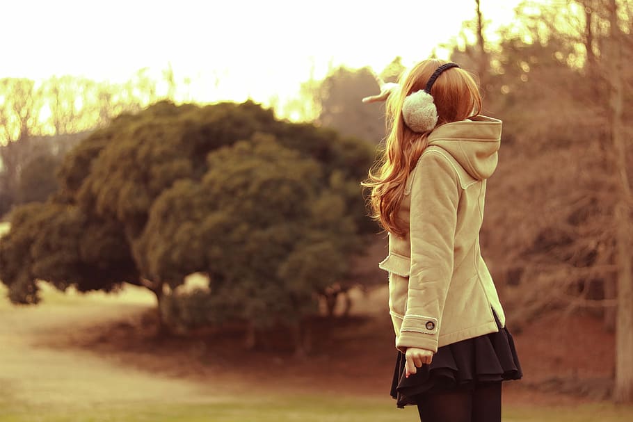 woman in hooded coat standing on green grass field, outdoors, HD wallpaper