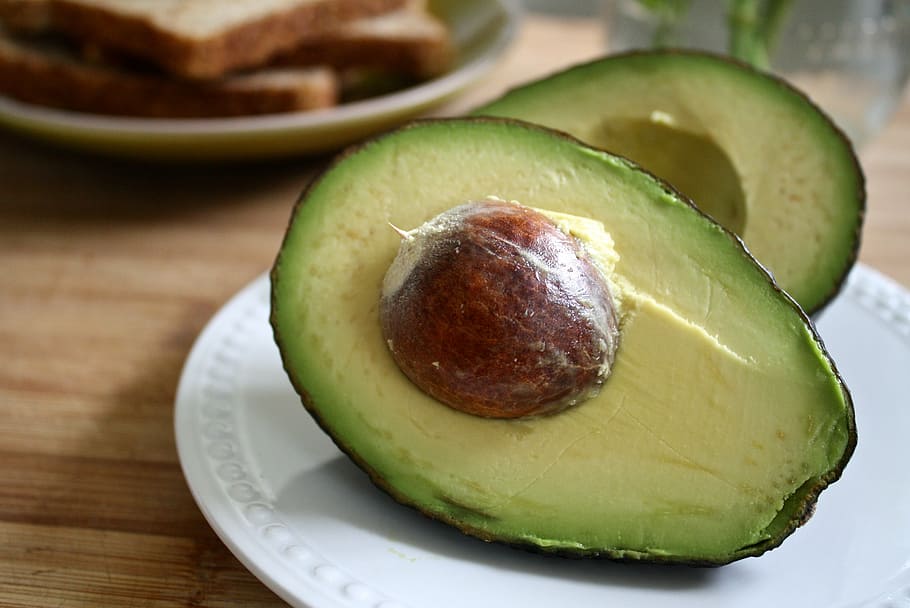 sliced avocado on white plate, breakfast, butter, sprouted bread HD wallpaper