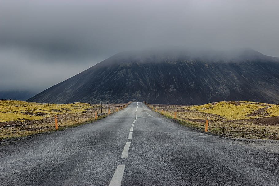 A road with mountains in the background in Iceland, nature, landscape