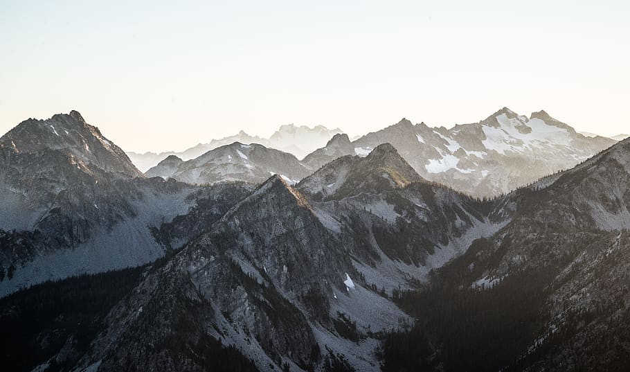 snow covered brown mountain during daytime, aerial photography of snow mountains HD wallpaper
