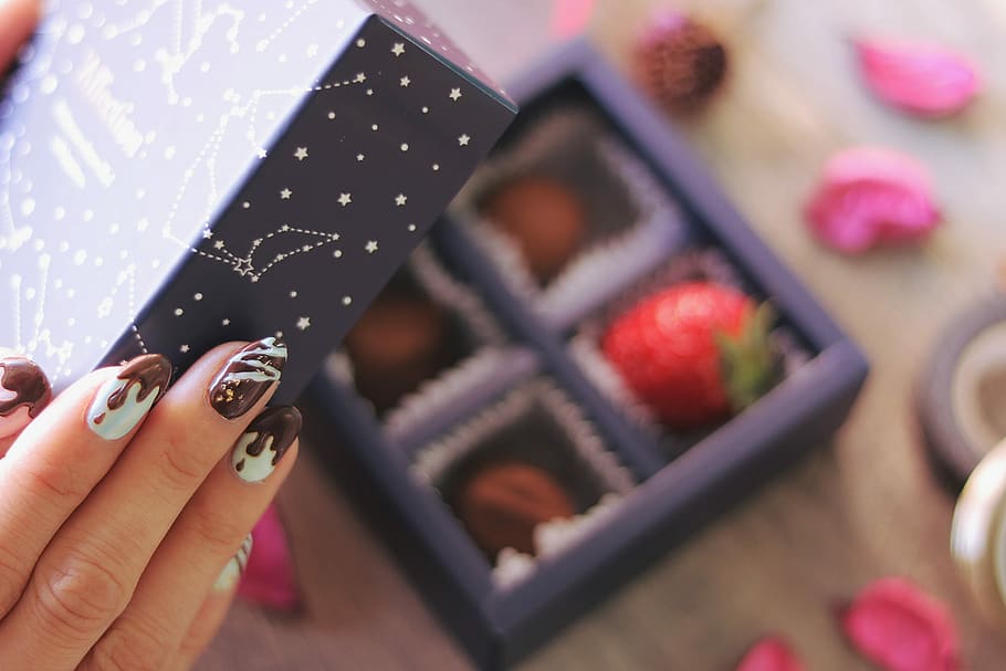 person open the purple box with chocolate inside, human Hand HD wallpaper