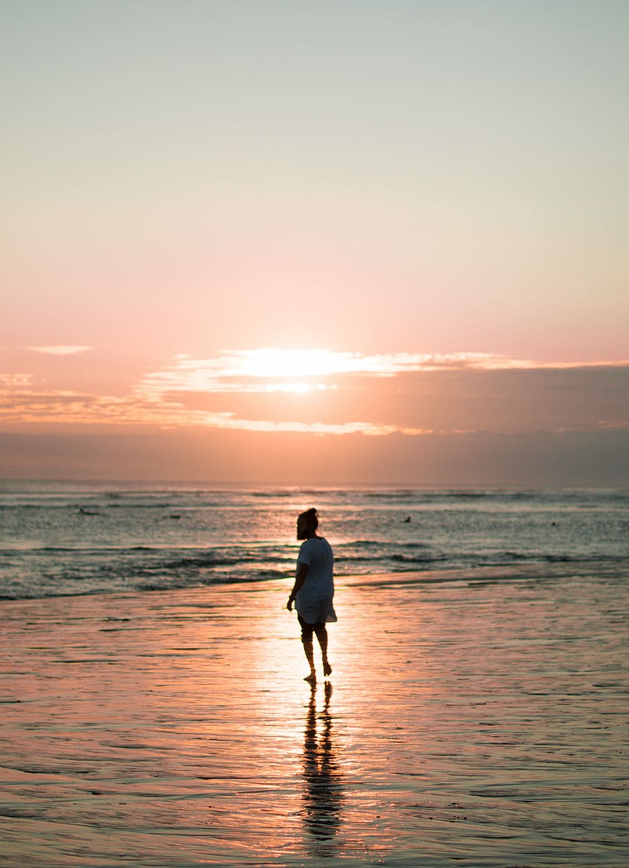 person walking on seashore during golden hour, woman walks on seashore during golden hour HD wallpaper