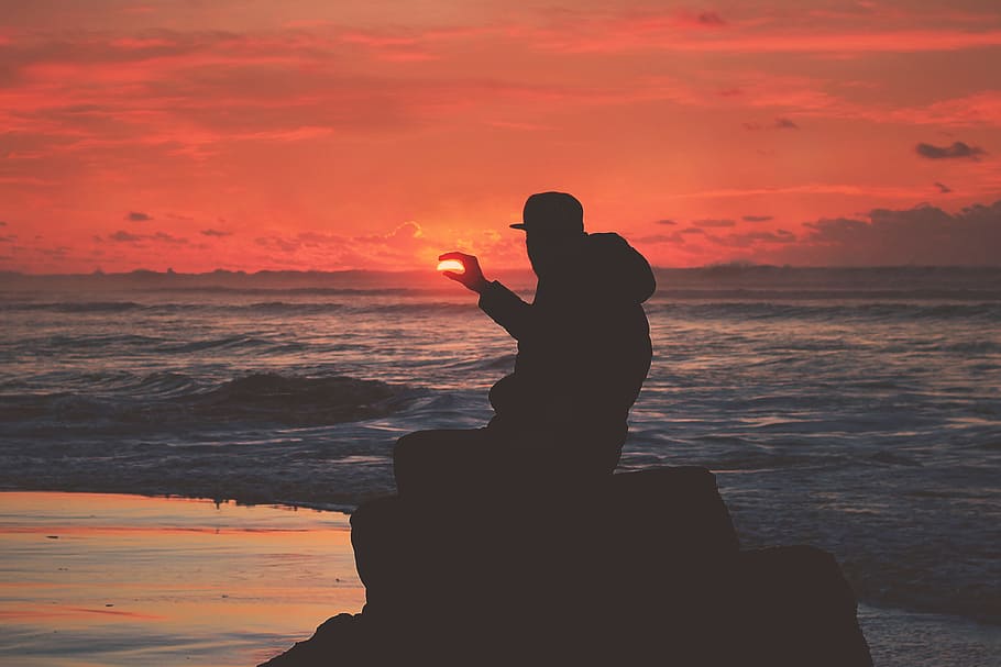Silhouette of a man on the coast at sunset, people, beach, nature