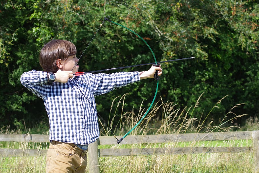 boy in blue and white checked sport shirt holding crossbow, archery, HD wallpaper