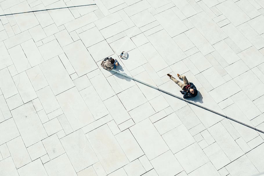 two persons on white concrete floor, familiy, aerial view, perspective