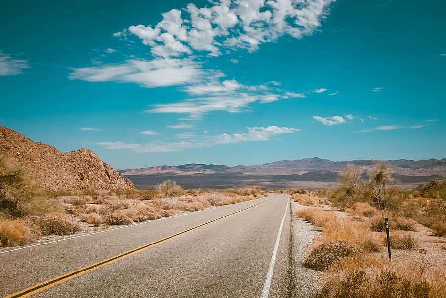 highway road photo during daytime, gray asphalt road, desert