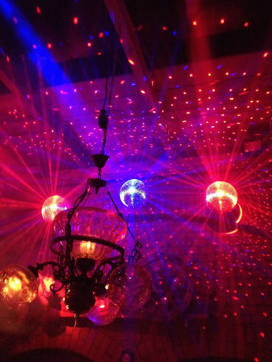 red disco lights and several disco balls, dance floor, nightclub