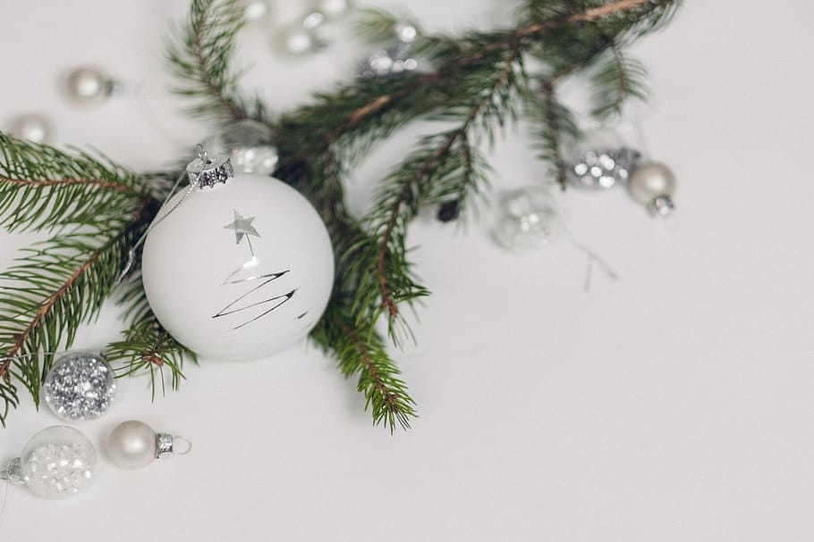 white bauble beside garland, close-up photography of white Christmas bauble and white pearl decorations HD wallpaper