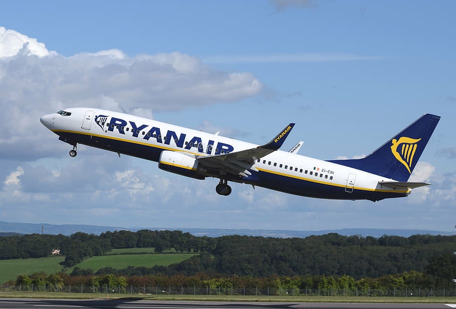 time lapse photography of blue and white Ryanair commercial airplane