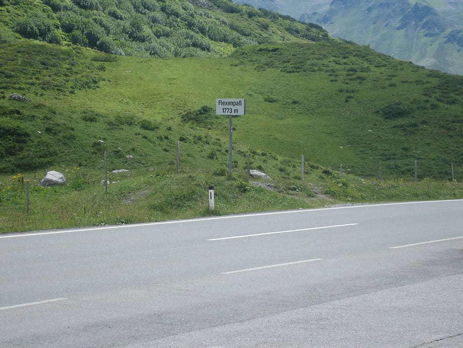 mountain, alpine, road, sign, transportation, symbol, plant HD wallpaper