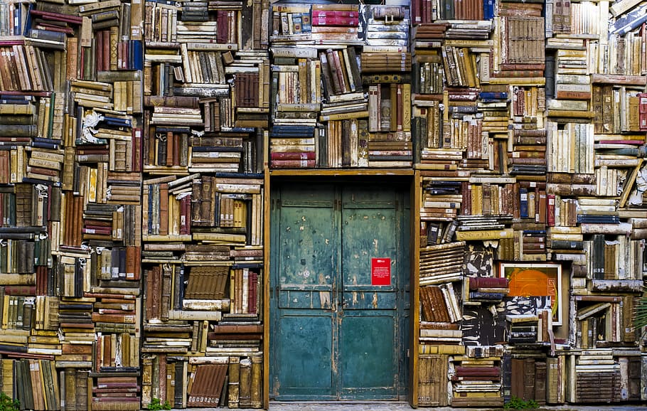 blue wooden door surrounded by book covered wall, green door HD wallpaper