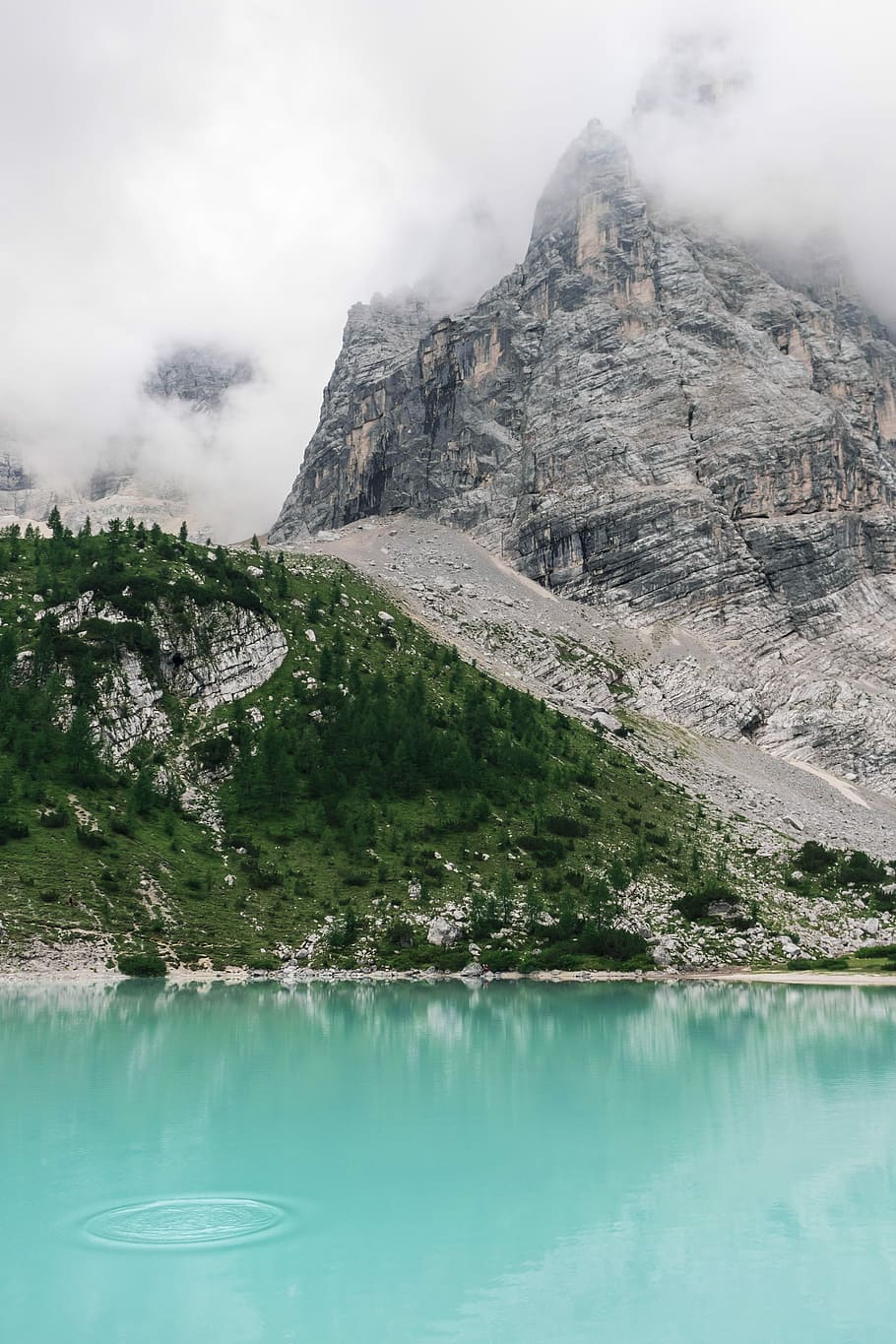 body of water near rock formation photography, river beside clouds covered mountain during day time HD wallpaper