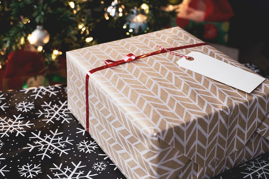 beige and white gift box on brown and white snowflake print textile HD wallpaper