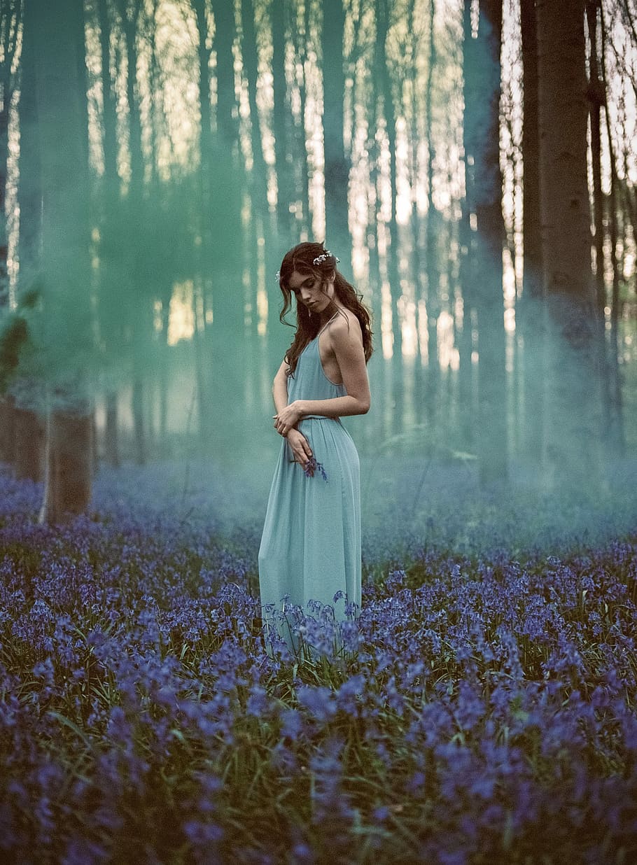 Otherworldly Beauty, woman wearing gray spaghetti strap maxi dress in the middle of forest surrounded by blue petaled flowers, HD wallpaper
