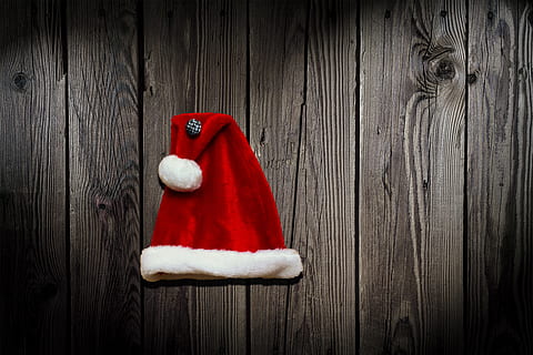 red santa hat on top of gray wood, cap, christmas, background HD wallpaper