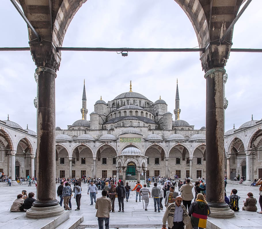 person sitting beside pillars, aya sofia, istanbul, blue, temple
