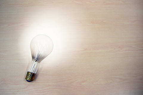turned on white bulb on brown wooden surface, light bulb, idea HD wallpaper