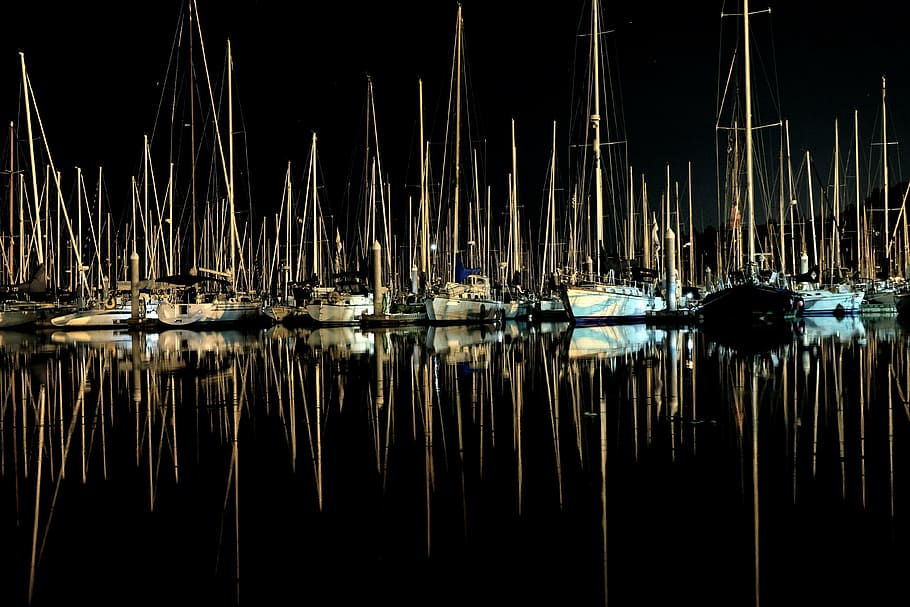 reflection photography of aligned sail boats, sailboats, calm