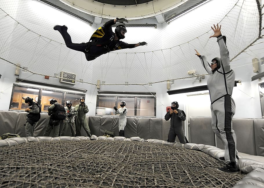 people inside air simulator practicing sky diving, skydiving HD wallpaper