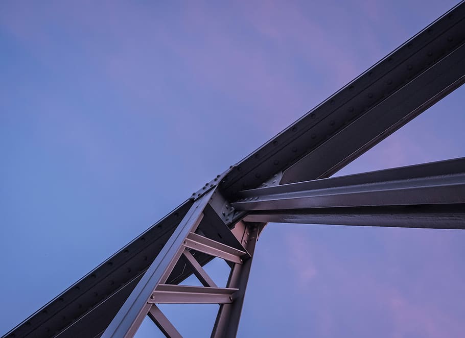 gray steel frame, low-angle photo of gray full-suspension bridge under blue sky at daytime HD wallpaper