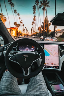 interior view of Tesla car, person in shorts inside of Tesla vehicle HD wallpaper