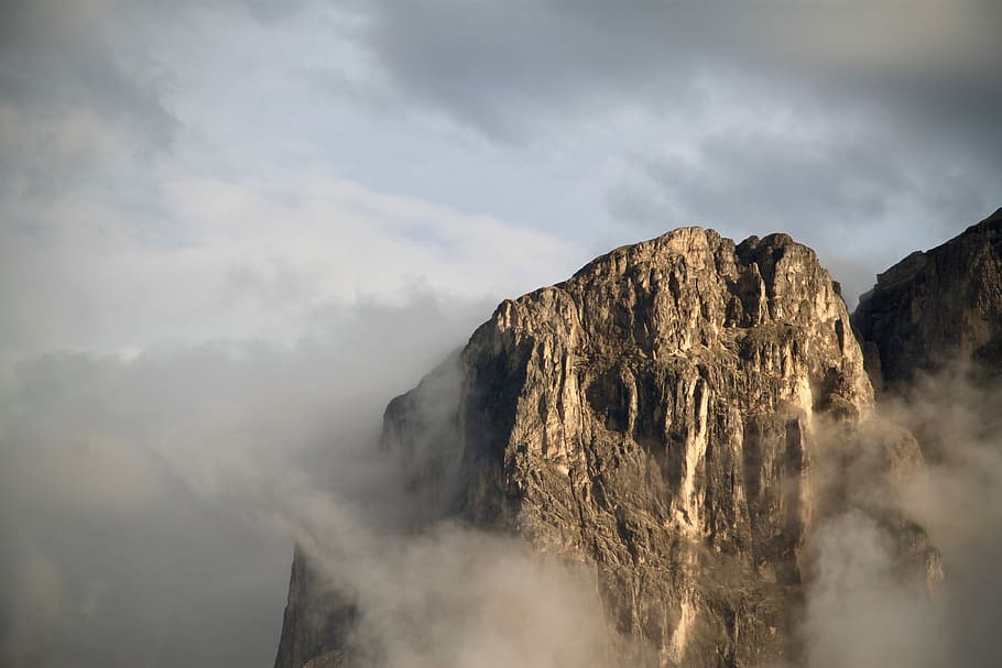 photo of gray rock formation covered in cloud, mountain and cloud HD wallpaper