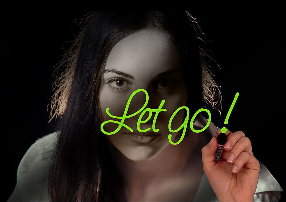woman wearing white shirt with let go! text overlay, face, head