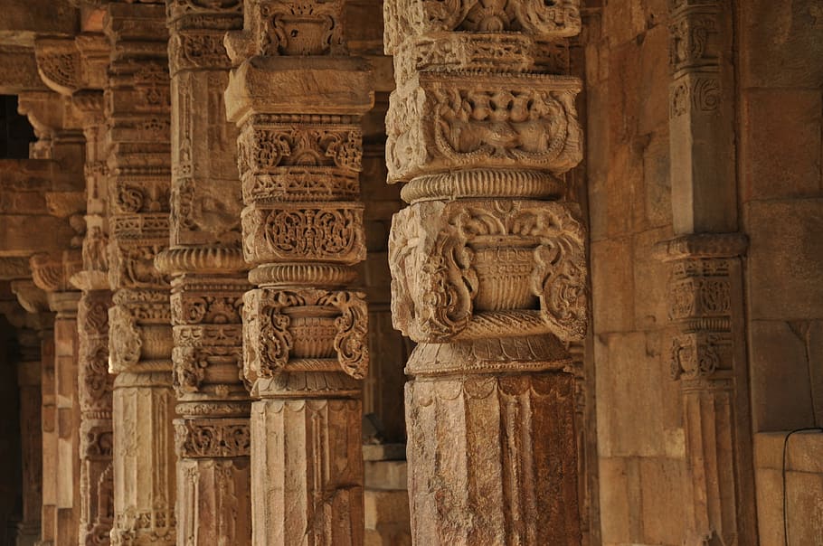 brown concrete columns, pillars, temple, carvings, stone, intricate