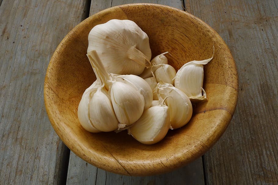 white garlic on brown wooden bowl, organic, fresh, vegetable