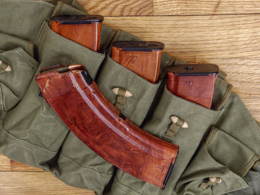 four brown rifle magazines on holster, Bakelite, Soviet, amunition magazines