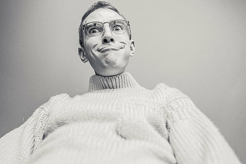 grayscale photo of man wearing knit sweater and eyeglasses HD wallpaper
