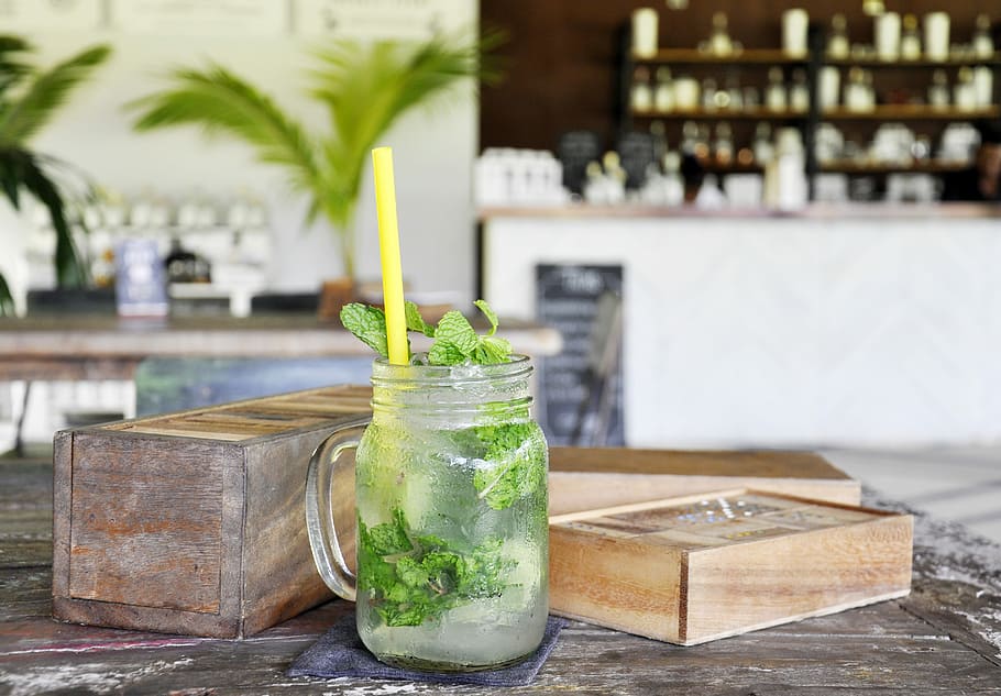 photo of beverage with yellow straw, clear glass mason jar near box HD wallpaper