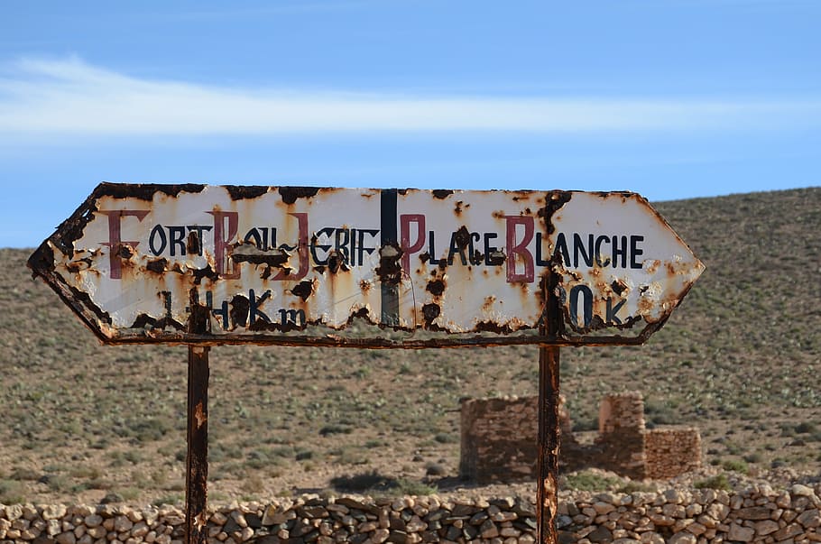 white and black Fort Bou Jerif PLace sign, plageblanche, beach HD wallpaper
