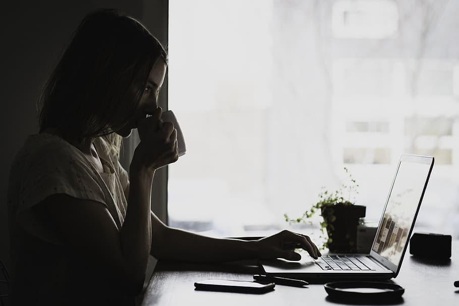 woman using laptop computer while drinking, apple, macbook HD wallpaper