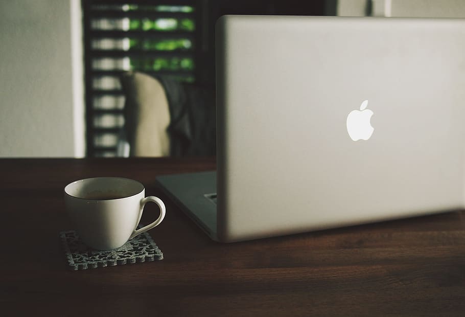 HD wallpaper: MacBook Pro on table near white ceramic teacup, apple, laptop  | Wallpaper Flare