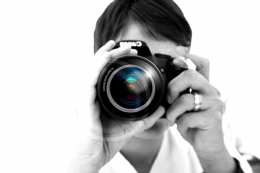 closeup photo of person holding camera, woman, hand, lens, photographer