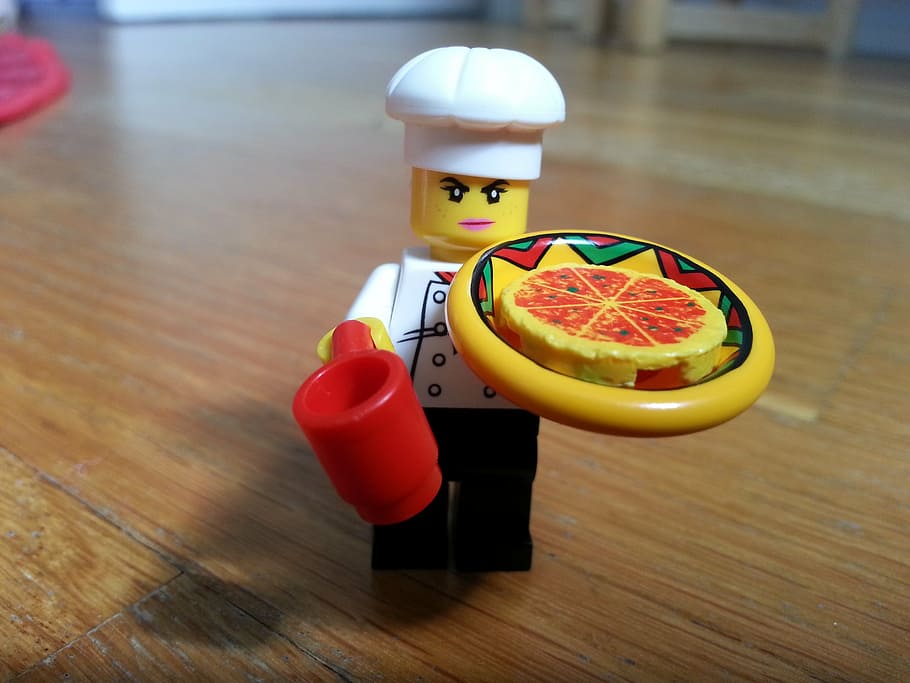 chef holding pizza Lego minifig on brown surface, character HD wallpaper