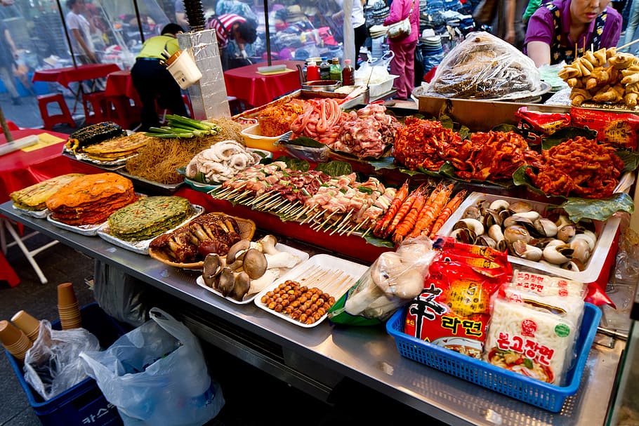 assorted street food lot on stainless steel table, namdaemun market