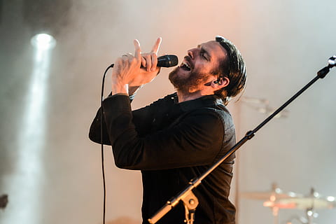 Man Wearing Black Collared Long Sleeve Shirt Holding Microphone HD wallpaper