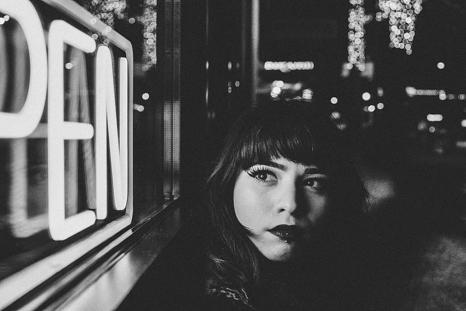 grayscale photo of woman beside open signage, grayscale photography of woman looking at OPEN neon signage HD wallpaper