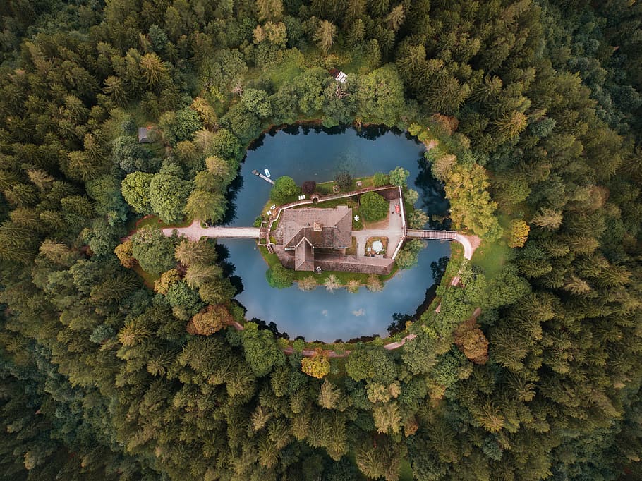 aerial photography of building surrounded with body of water and trees during daytime, bird's eye view of grey house surrounded by body of water, HD wallpaper